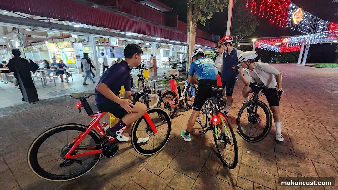 Cyclists gathered at a food court