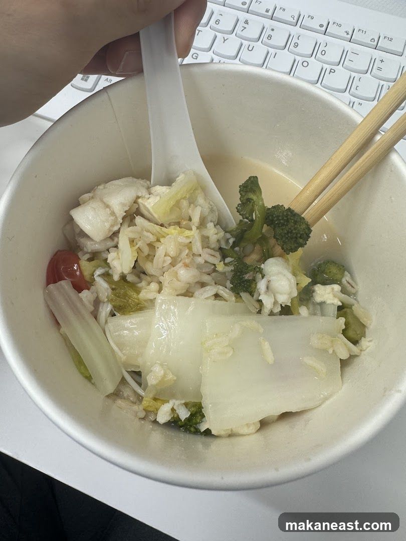 Bowl of food with rice and vegetables