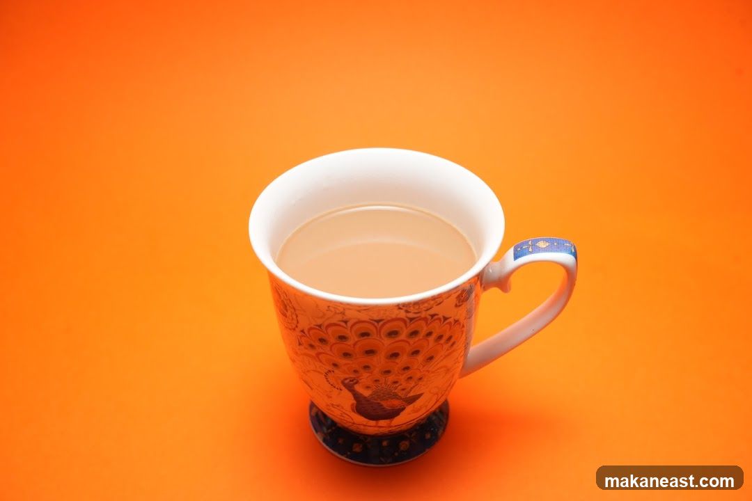 A cup of tea with a peacock design