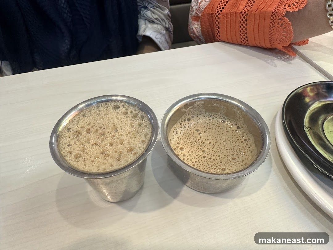 Two cups of frothy coffee