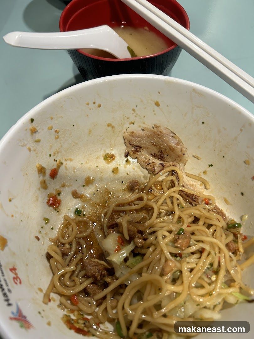 Partially Eaten Noodles and Soup