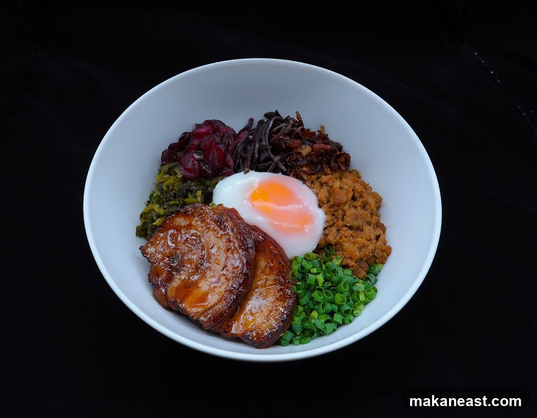 Bowl of food with meat and egg
