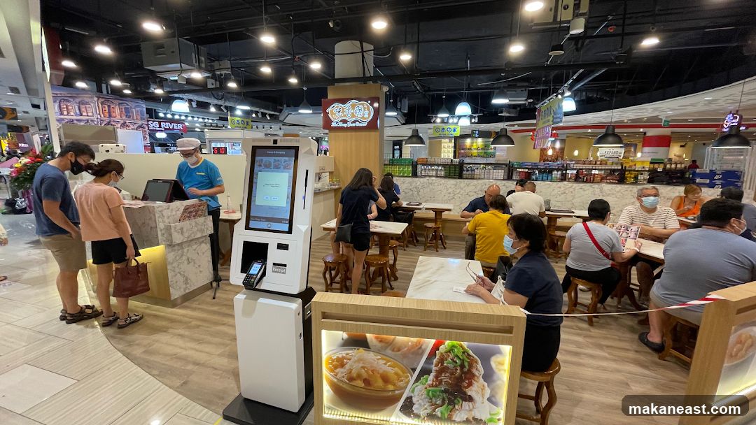 Food court with customers ordering and dining