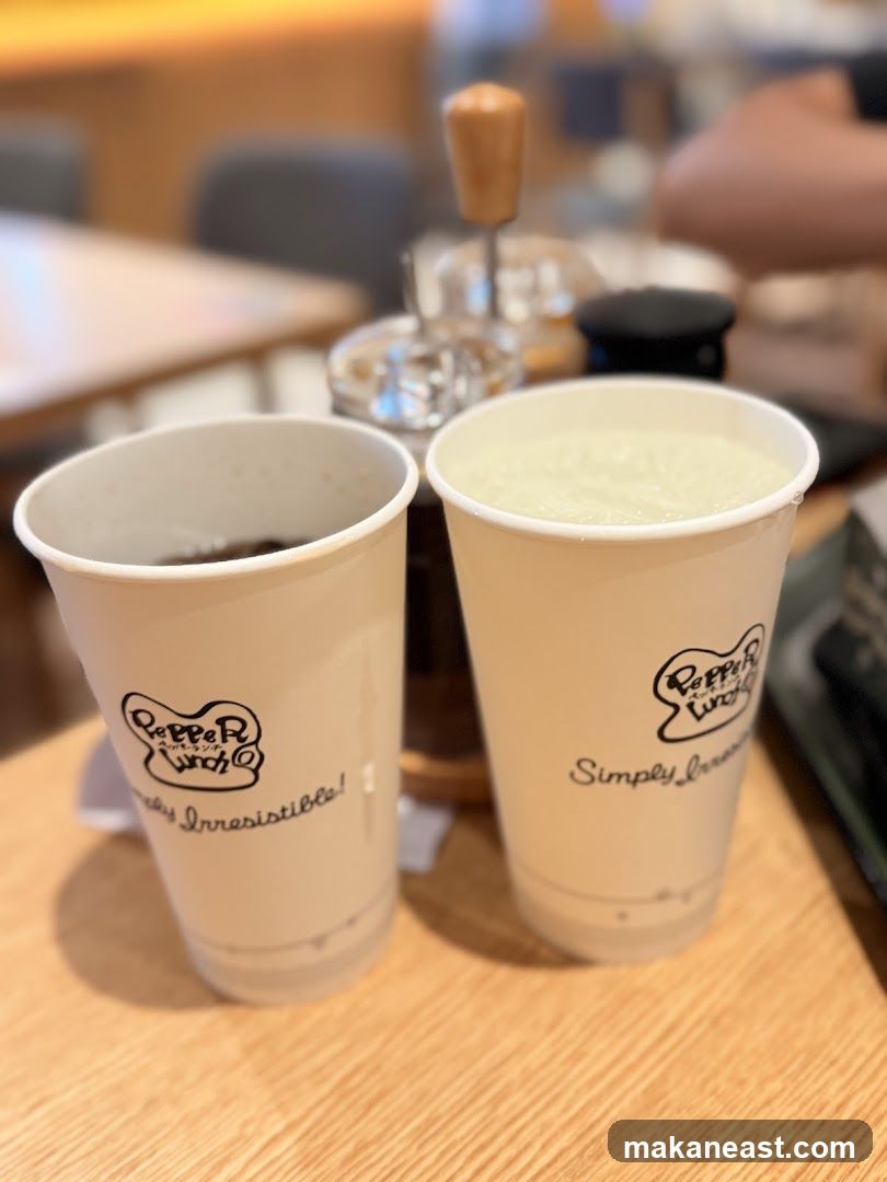 Two Paper Cups with Drinks