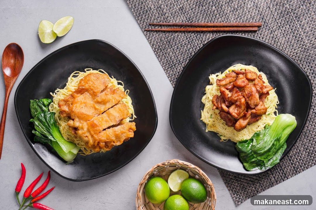 Two plates of noodles with meat and vegetables