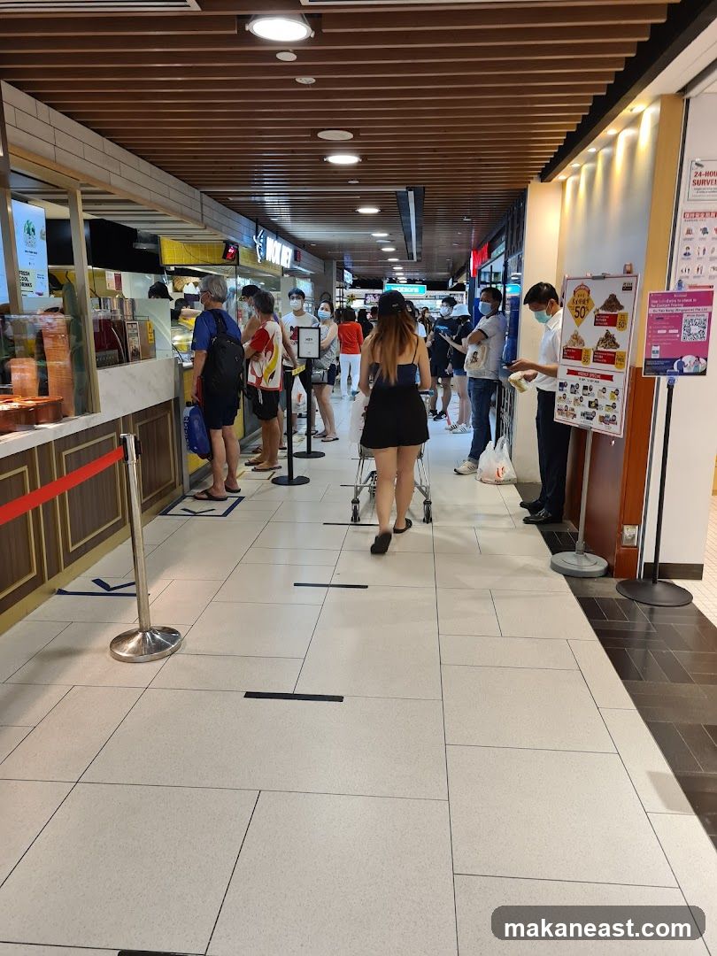 People queuing at a food stall