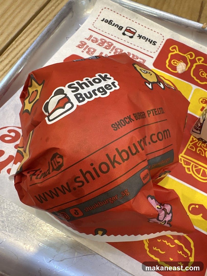 Burger Wrapped in Branded Paper