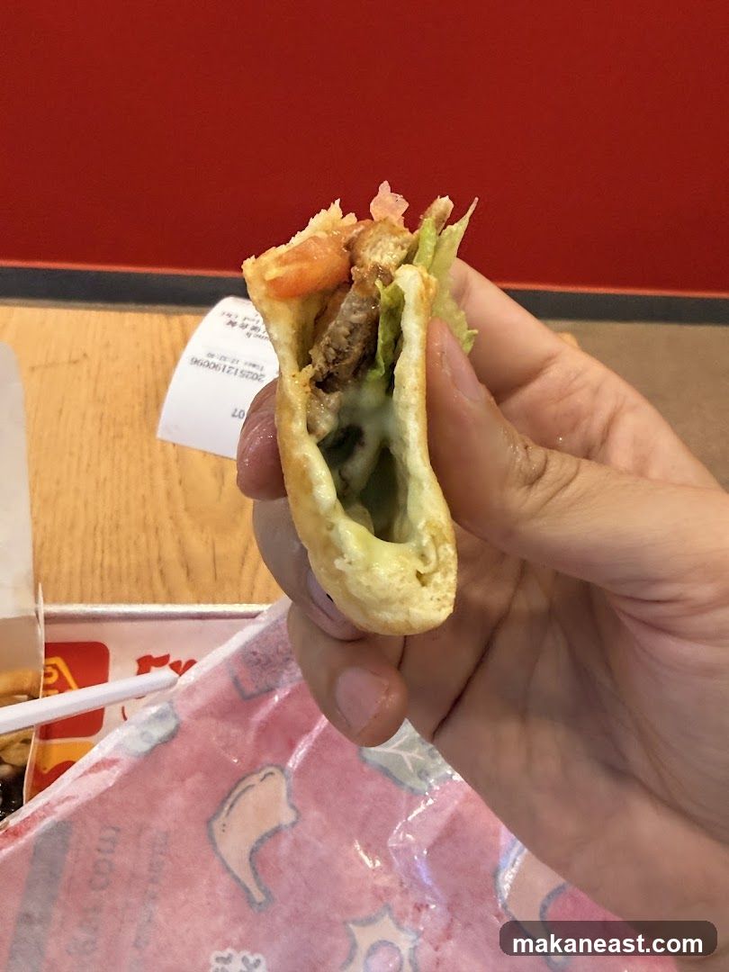 Hand holding a taco