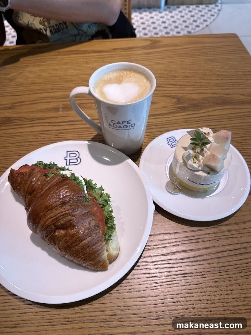 Croissant sandwich, cake, and coffee