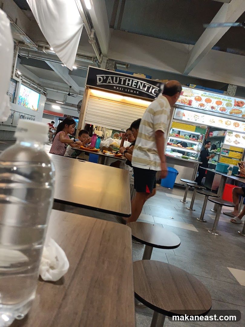 Food court with dining tables and a food stall