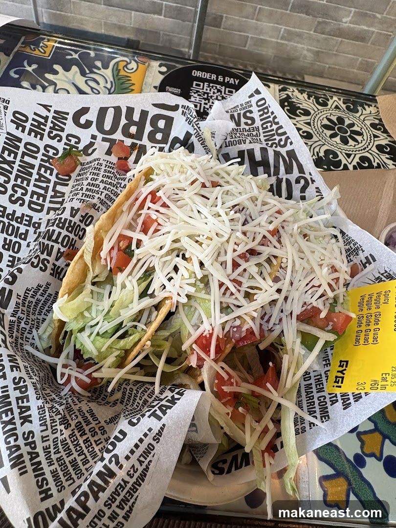 Taco with shredded cheese and lettuce