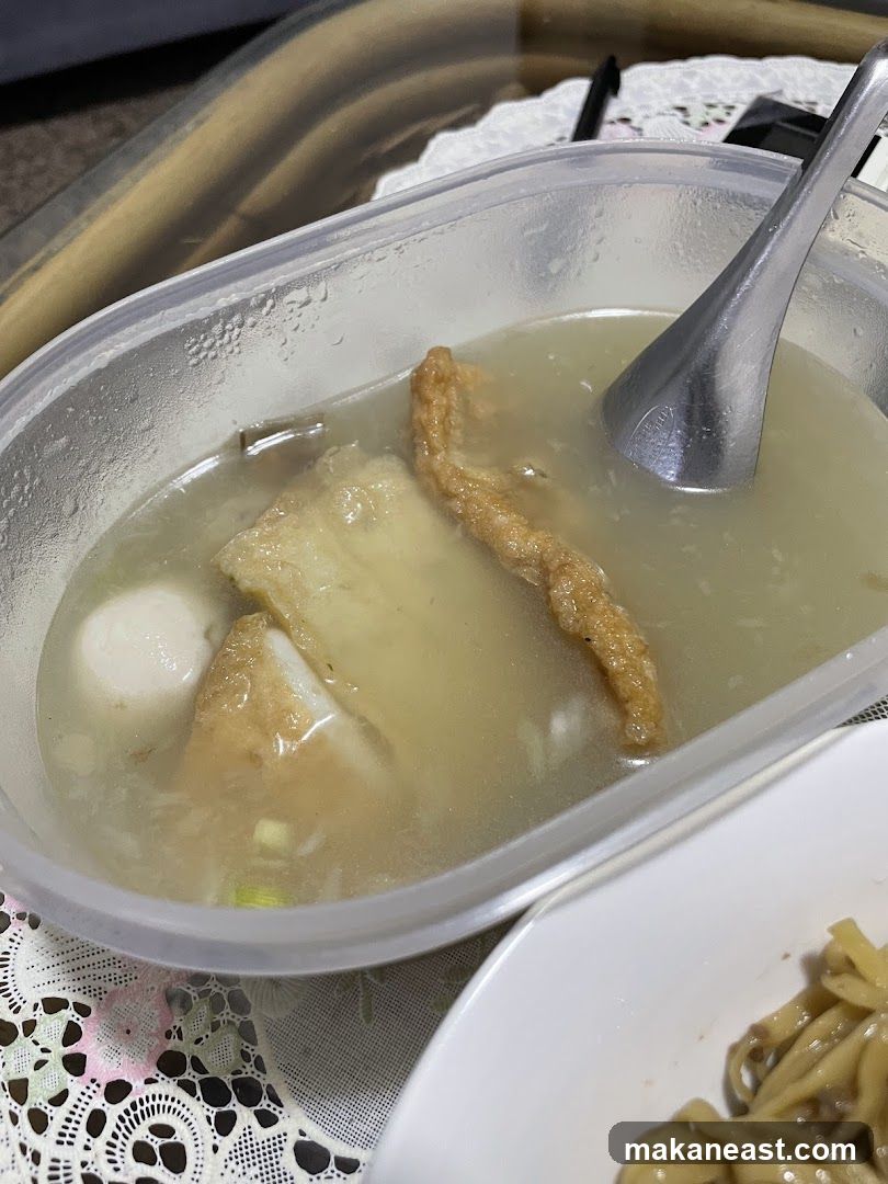 Fish cake and meatballs in broth