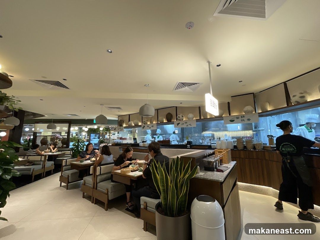 Restaurant Interior with Diners and Kitchen Staff