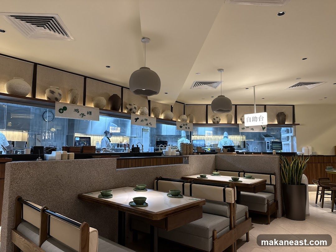 Restaurant Interior with Dining Tables and Kitchen Area