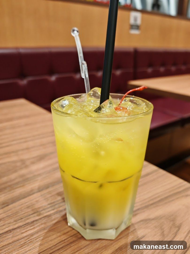 Yellow Cocktail with Cherry