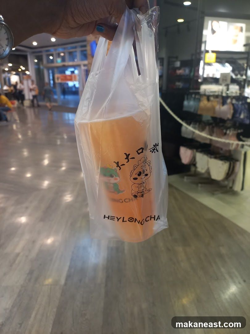 Beverage in a branded plastic bag