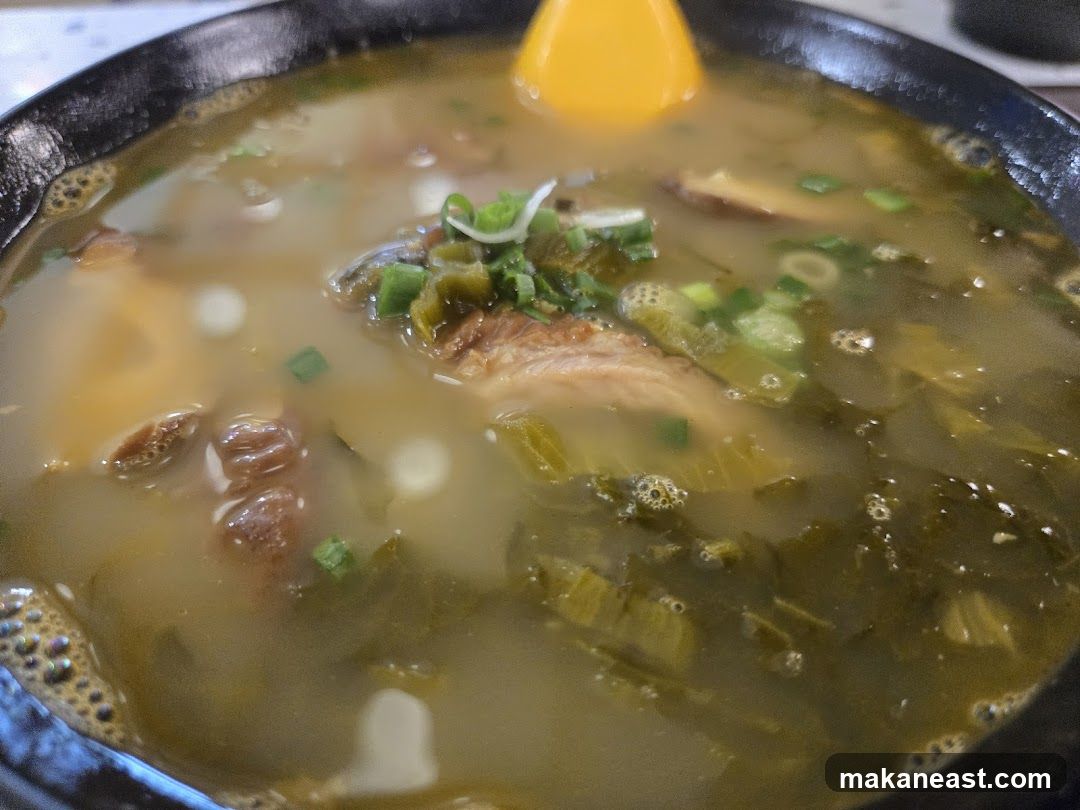 Bowl of Soup with Meat and Greens