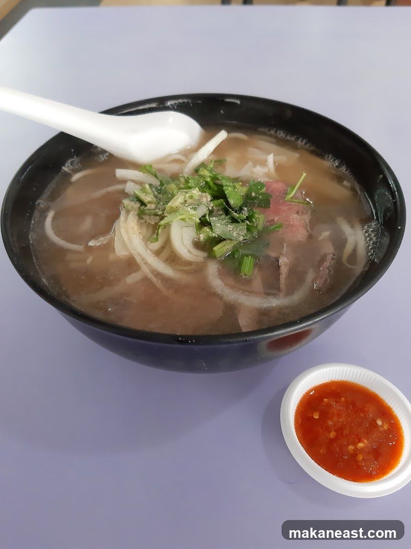 Bowl of Pho with Chili Sauce