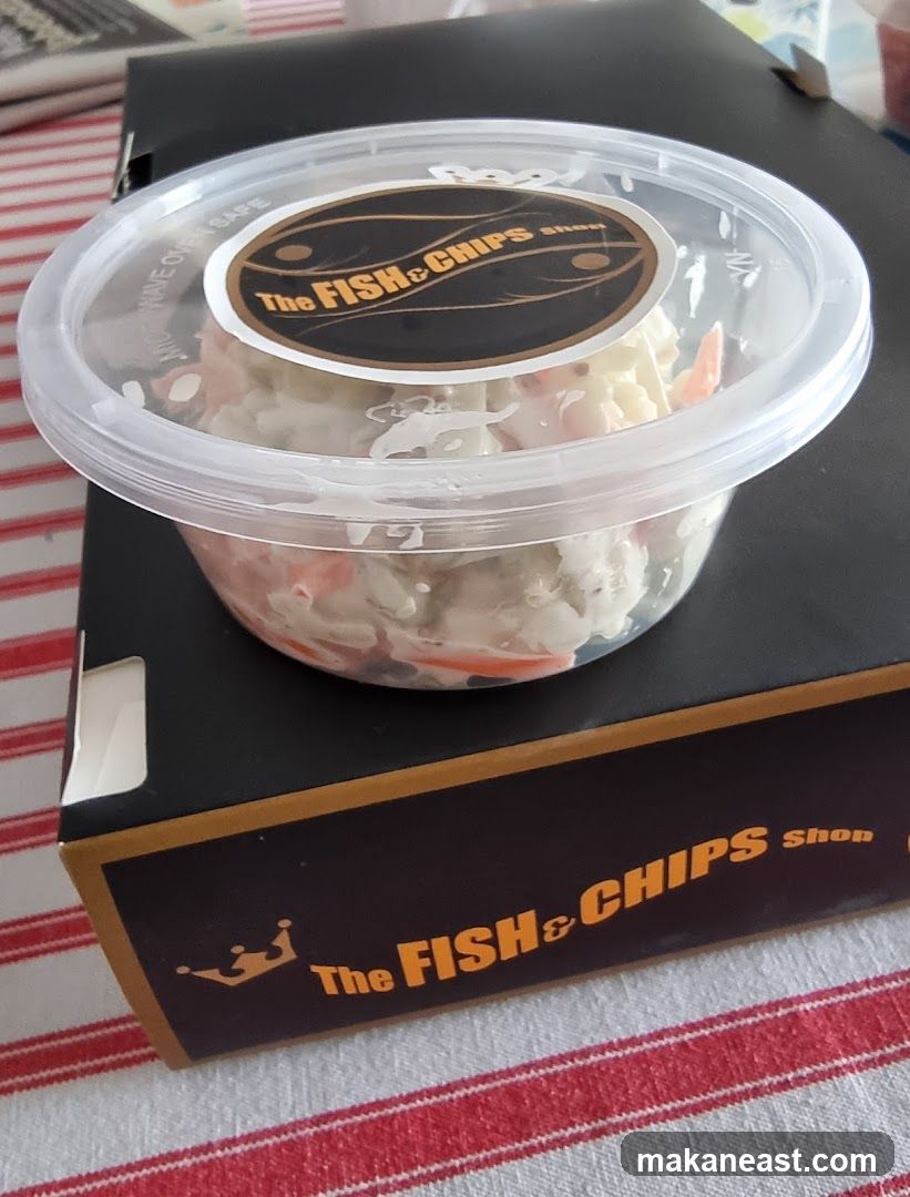 Coleslaw in a container on a box