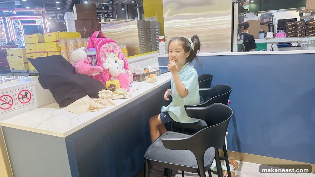 Girl eating at a counter