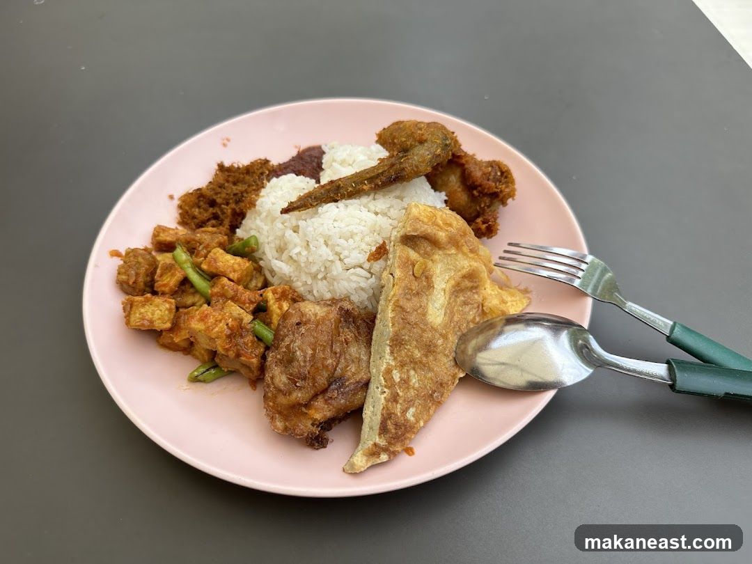 Plate of Food with Rice and Various Toppings