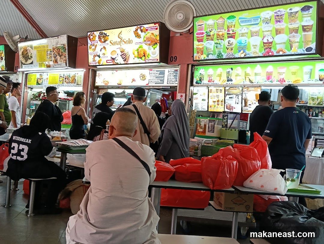 Food stalls with menus and customers