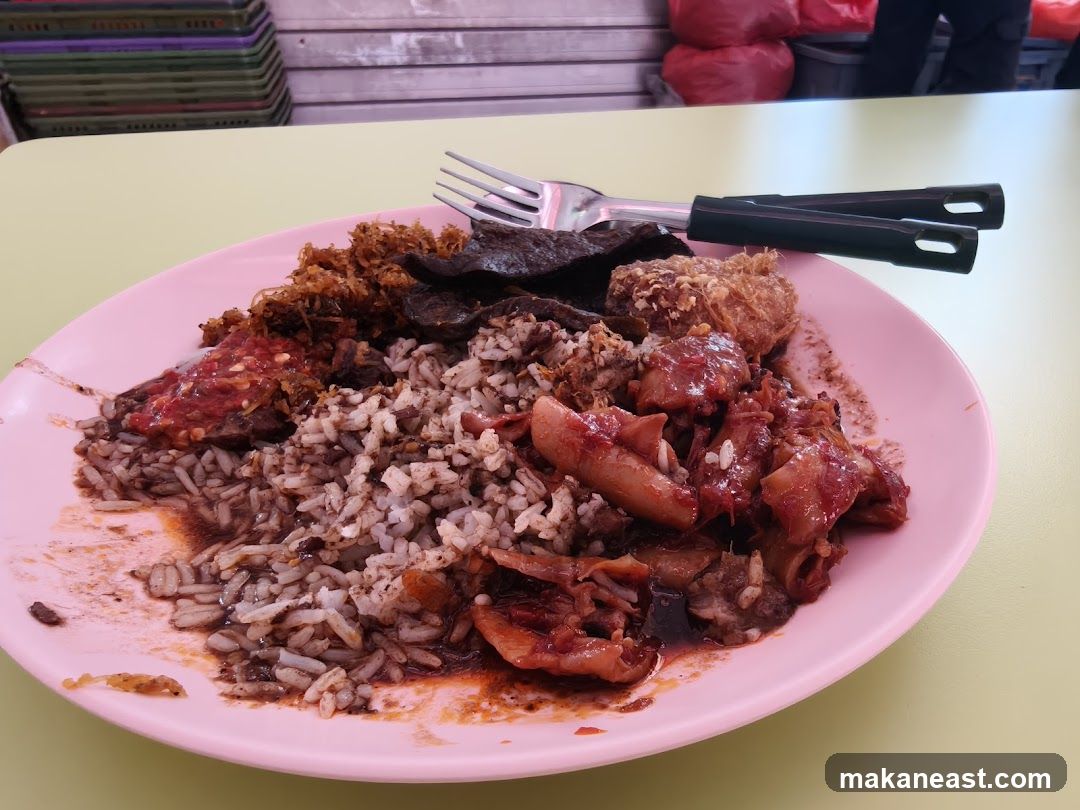 Plate of Rice with Various Toppings