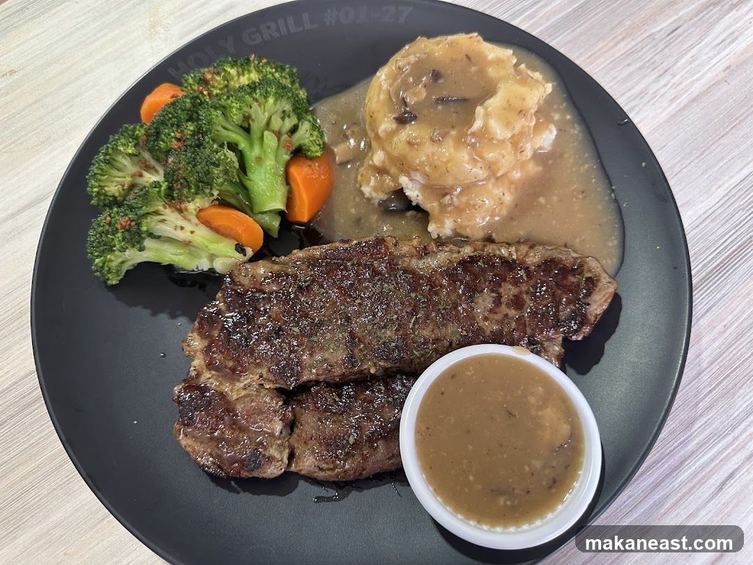 Steak with mashed potatoes and vegetables