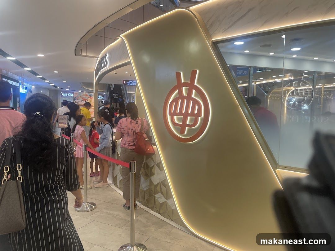 People in a queue at a food establishment