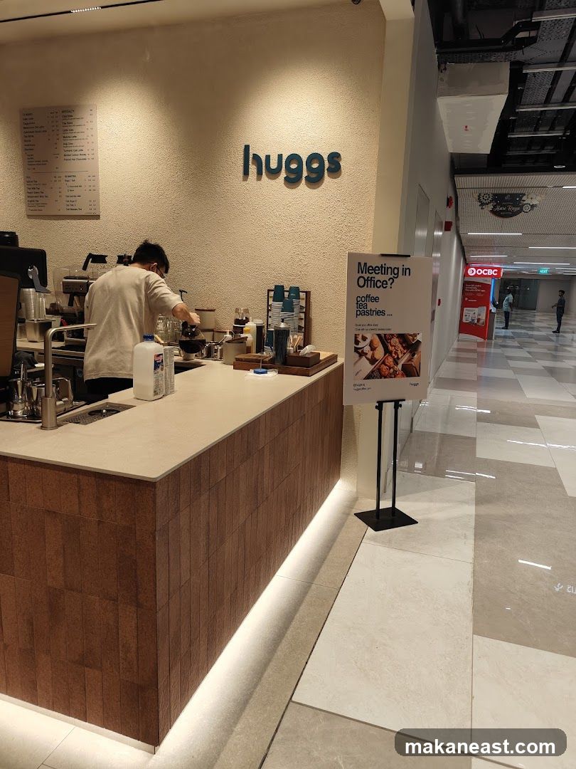 Coffee shop counter with menu and advertisement