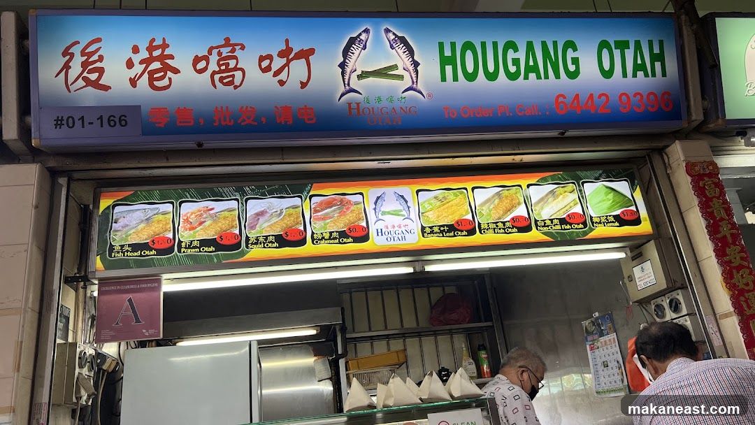 A brightly lit storefront with a large sign displaying the business name "HOUGANG OTAH" in English and Chinese. Below the main sign is a display of various otah dishes with their names and prices. Two customers are visible at the counter.