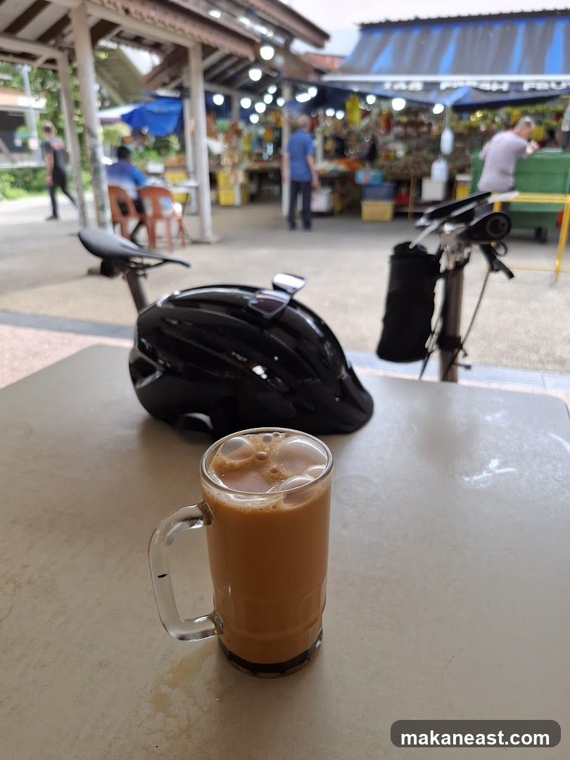 Outdoor market scene with a drink