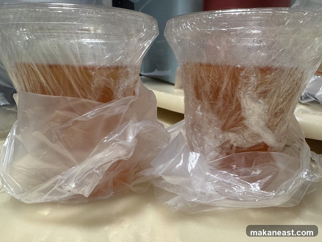 Two drinks in plastic cups