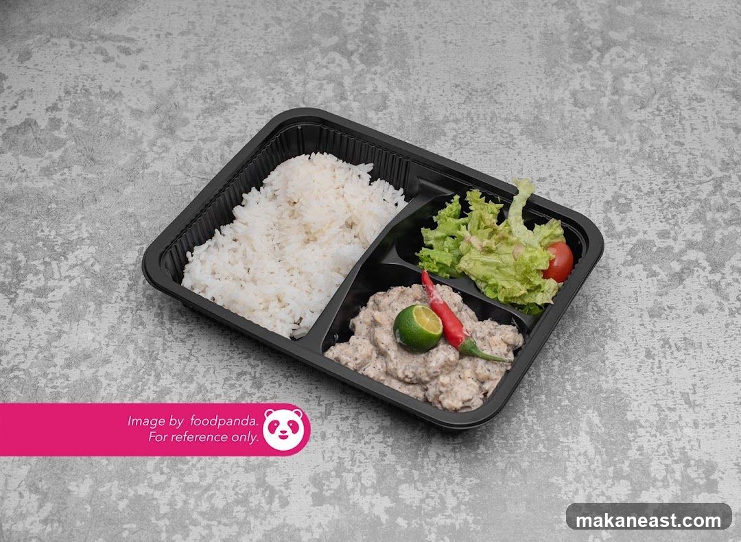 Meal Tray with Rice, Salad, and Meat Dish