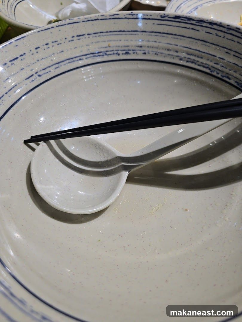 Empty Ramen Bowl with Chopsticks and Spoon