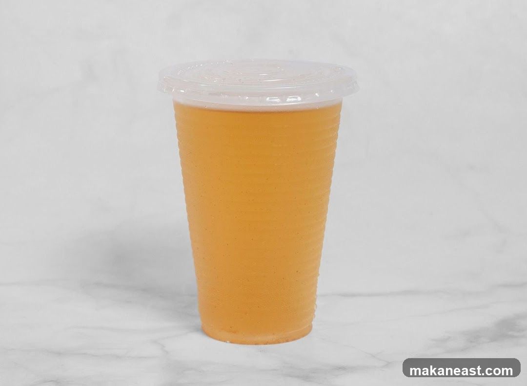 Orange Drink in a Plastic Cup