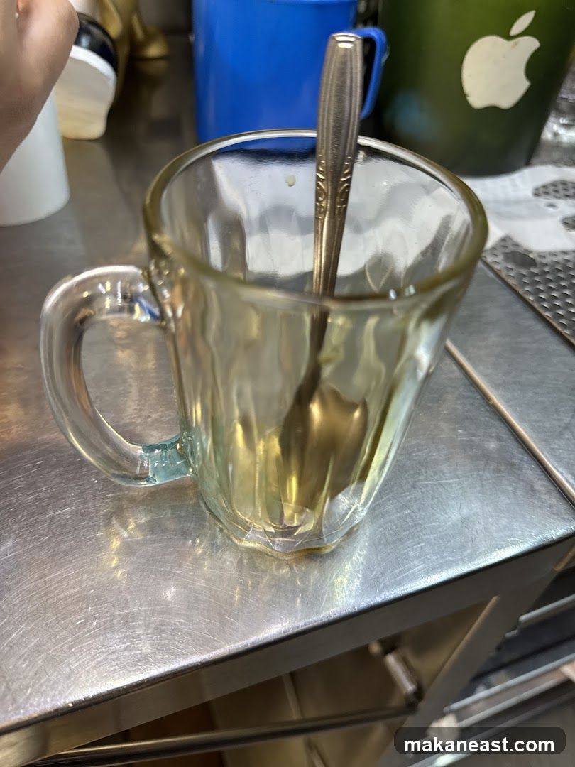 Empty Glass Mug with Spoon
