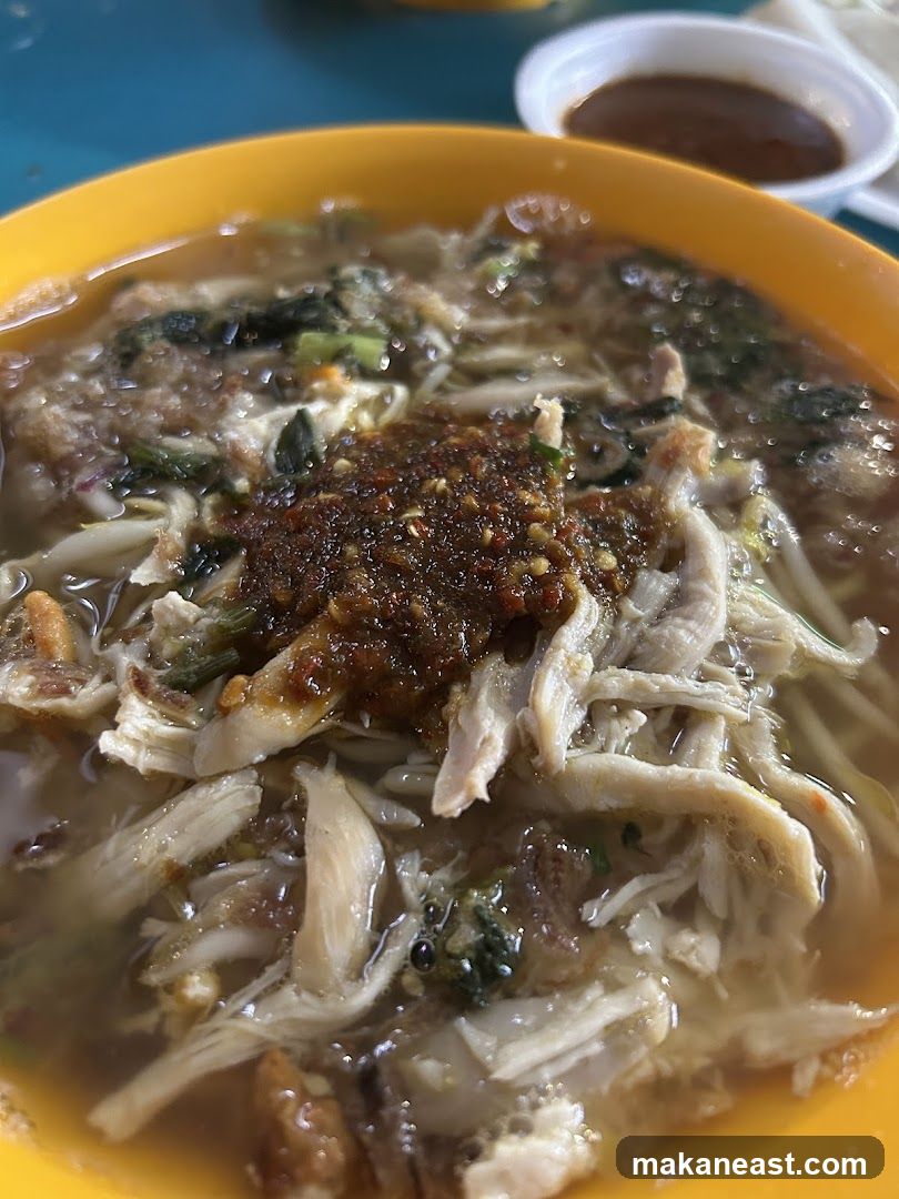 Bowl of Noodles with Shredded Chicken and Chili Paste