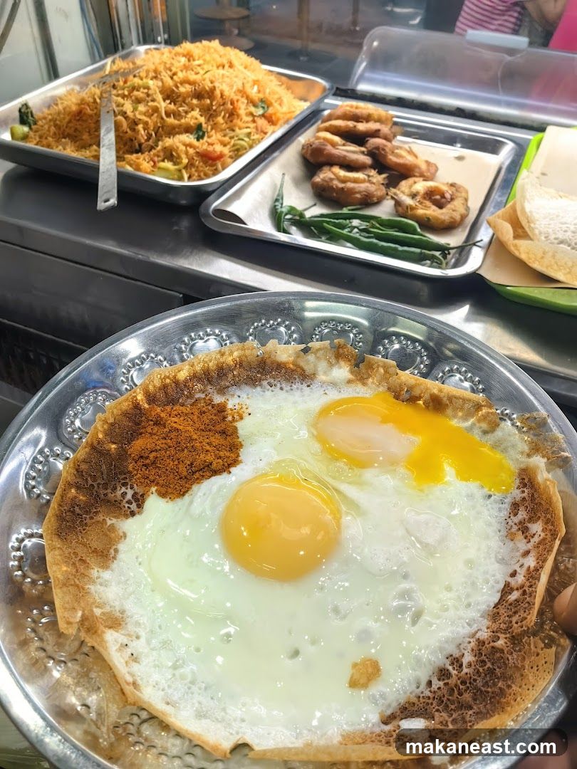 Fried Eggs with Spices and Rice