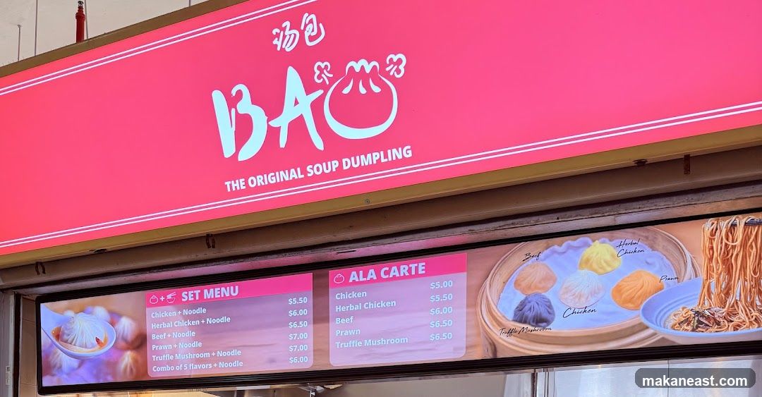 A menu board displaying set menus and a la carte options for soup dumplings and noodles. Images of dumplings and noodles are shown.