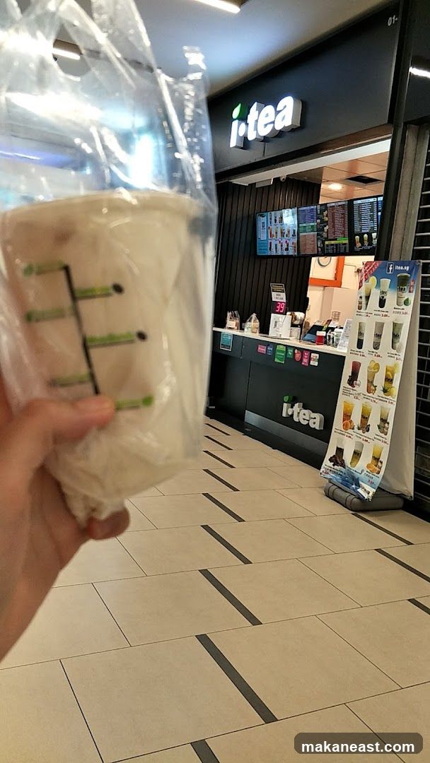 i-tea shop front with a drink