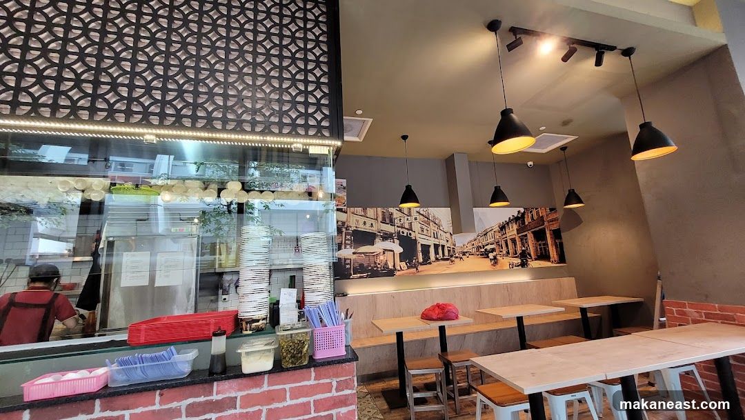 Restaurant Interior with Seating and Kitchen View