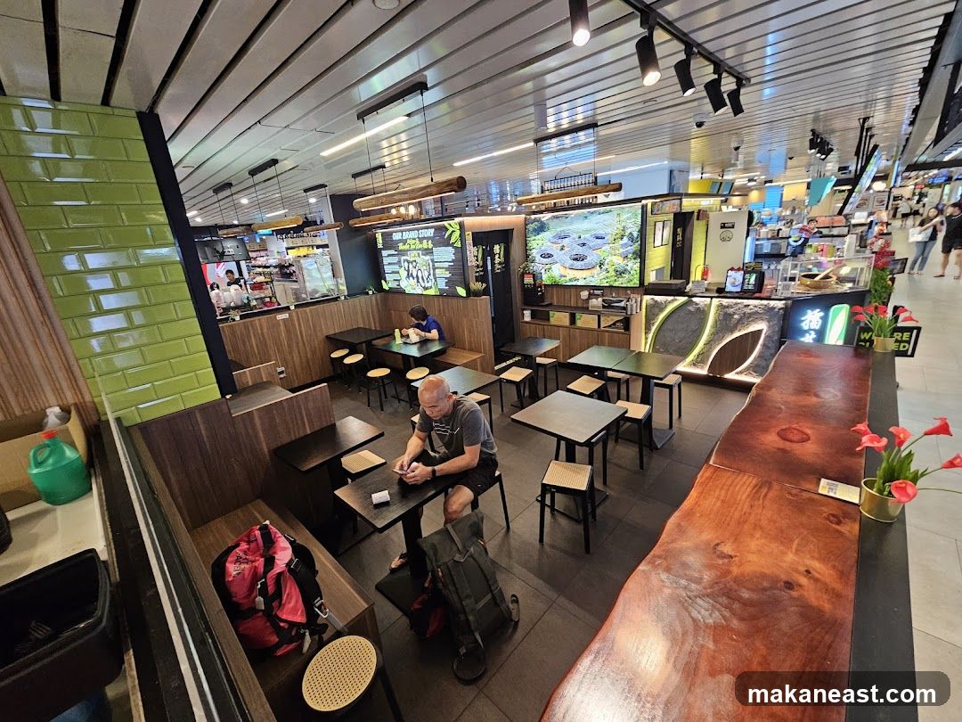 Interior of a modern cafe with seating and a counter