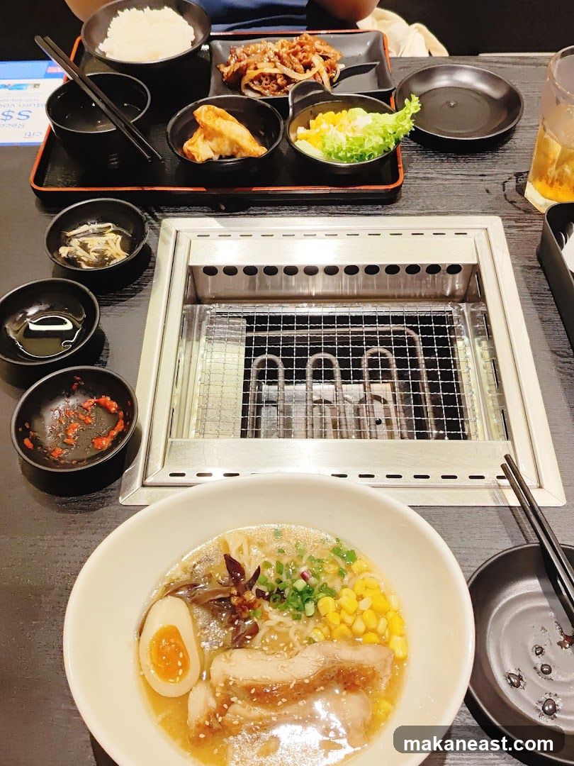 Table with Ramen and Grilled Meats