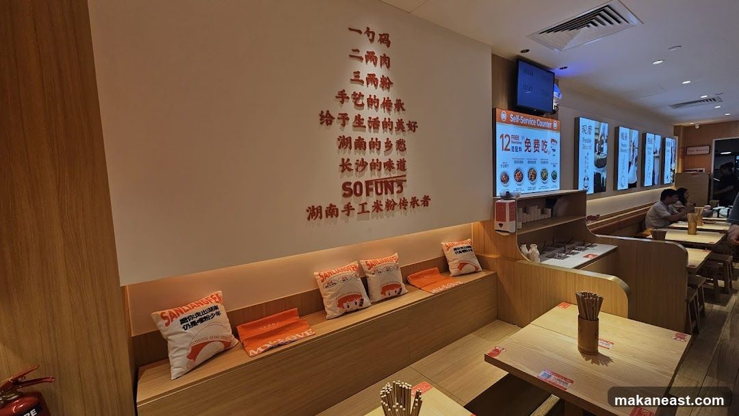 Restaurant Interior with Chinese Text and Self-Service Counter