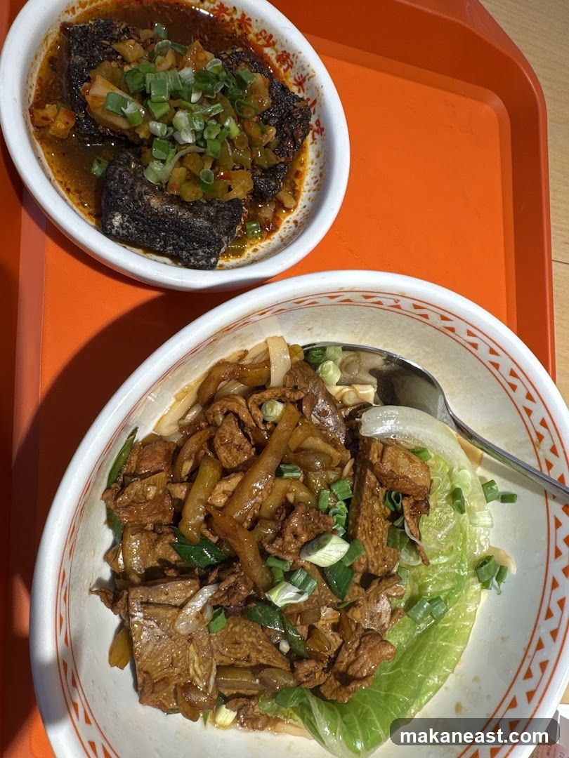 Two bowls of food on an orange tray