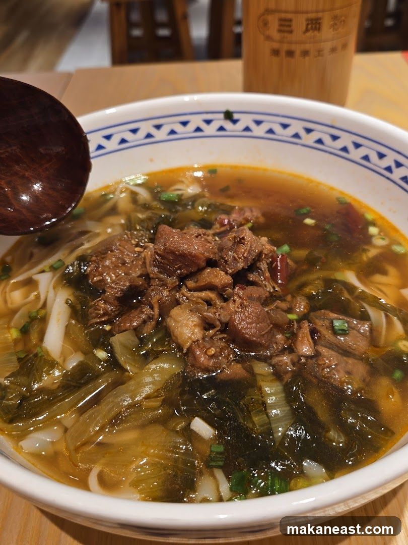 Bowl of Noodles with Beef and Greens