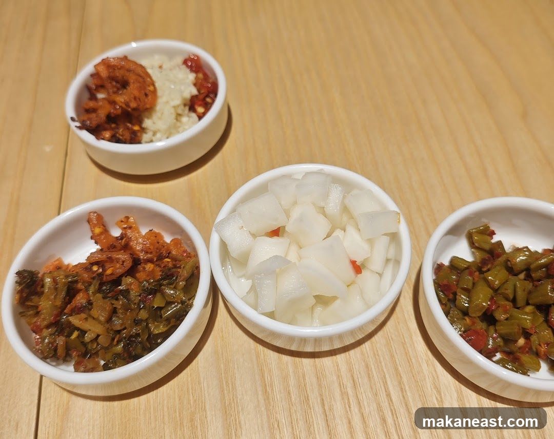 Four Small Bowls of Pickled Vegetables