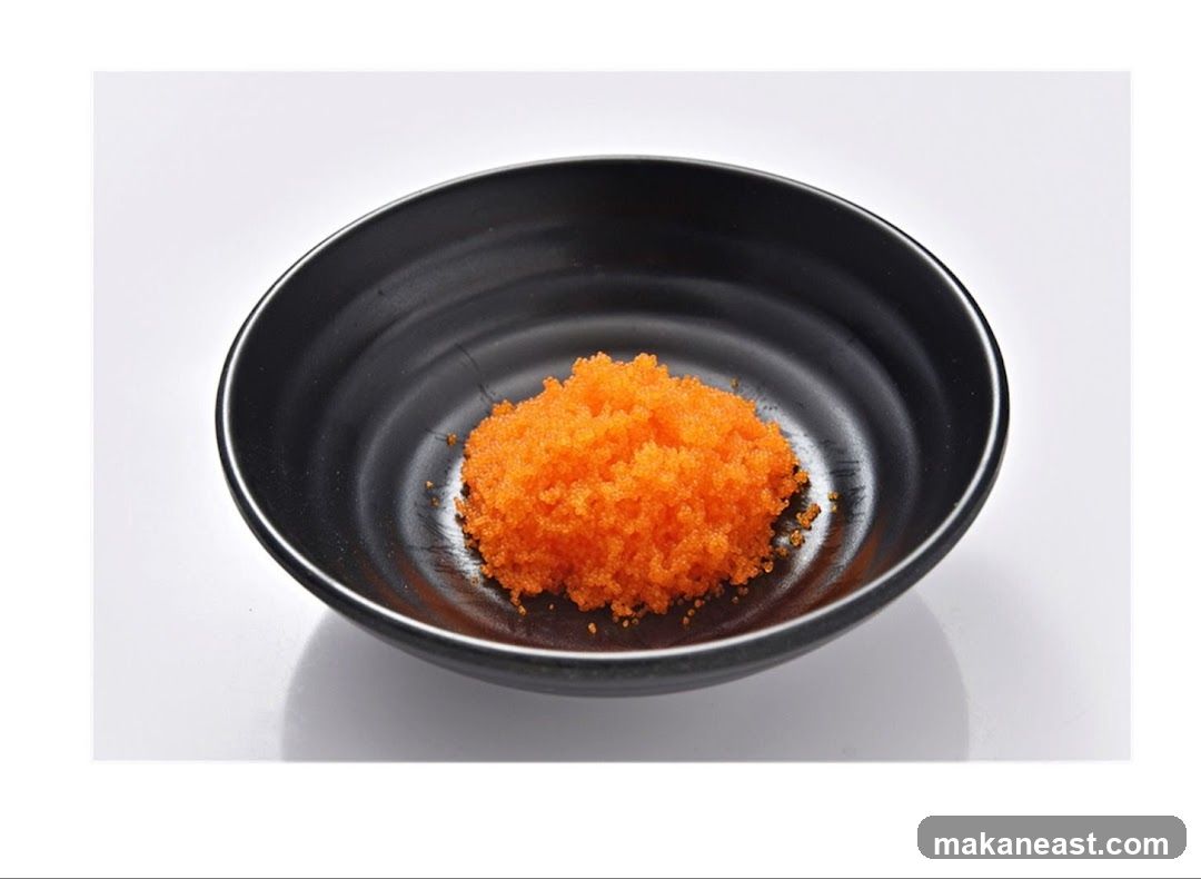 Orange Tobiko in a Black Bowl