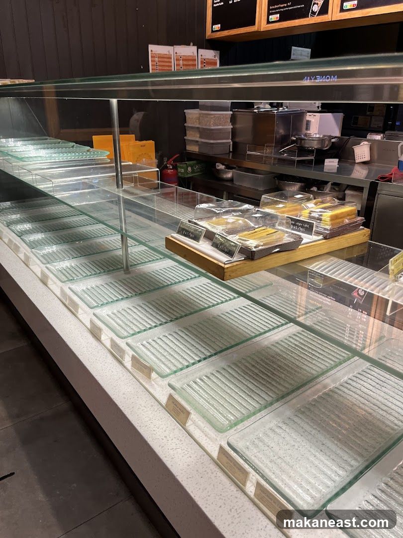 Empty Display Case with Some Desserts